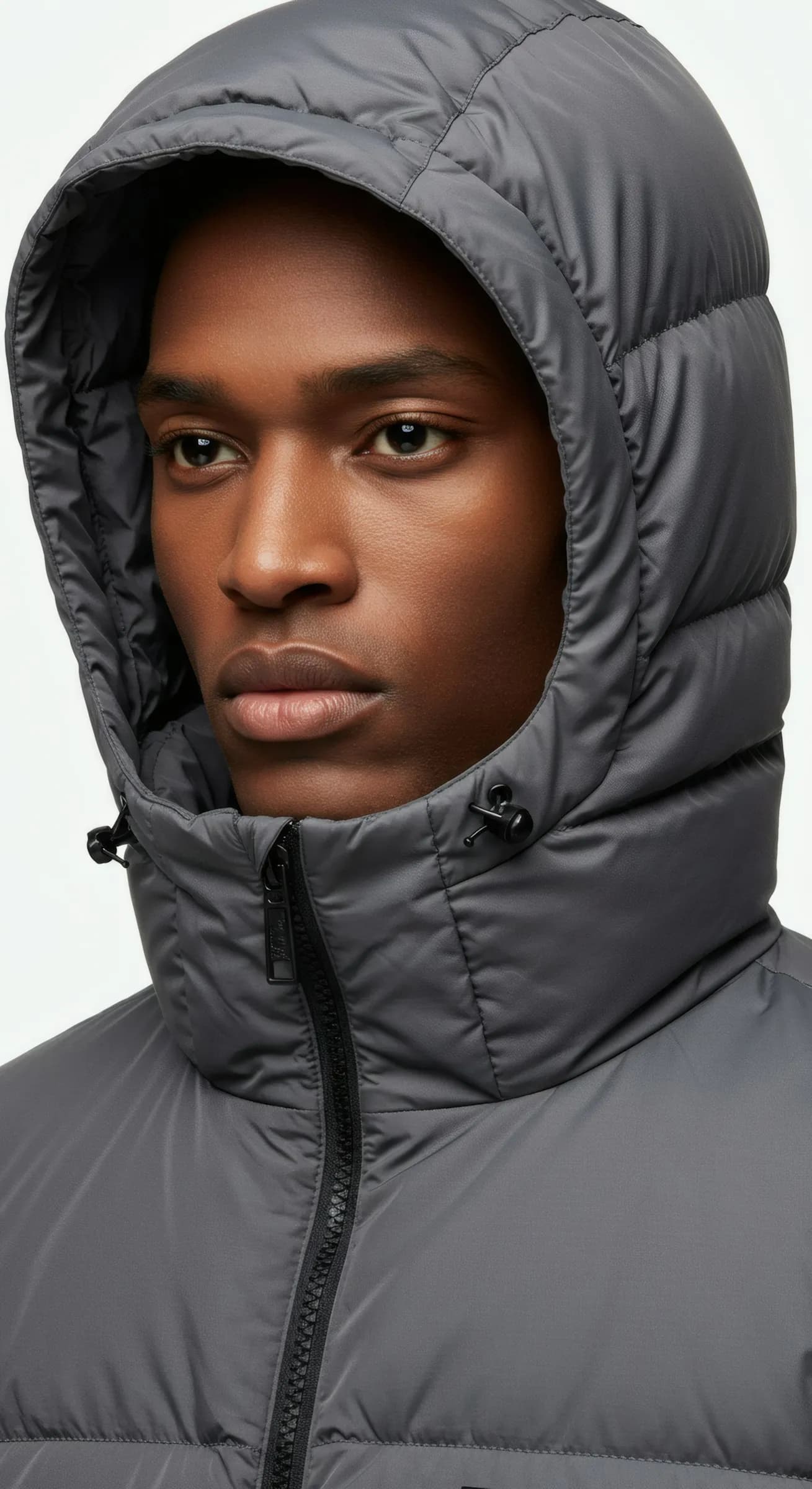 Young man in grey hooded jacket